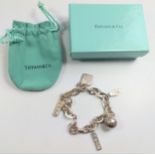 A Tiffany silver five-charm rectangular link bracelet.