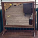 An antique mahogany toilet mirror. 54cm x 51cm (feet 22cm)