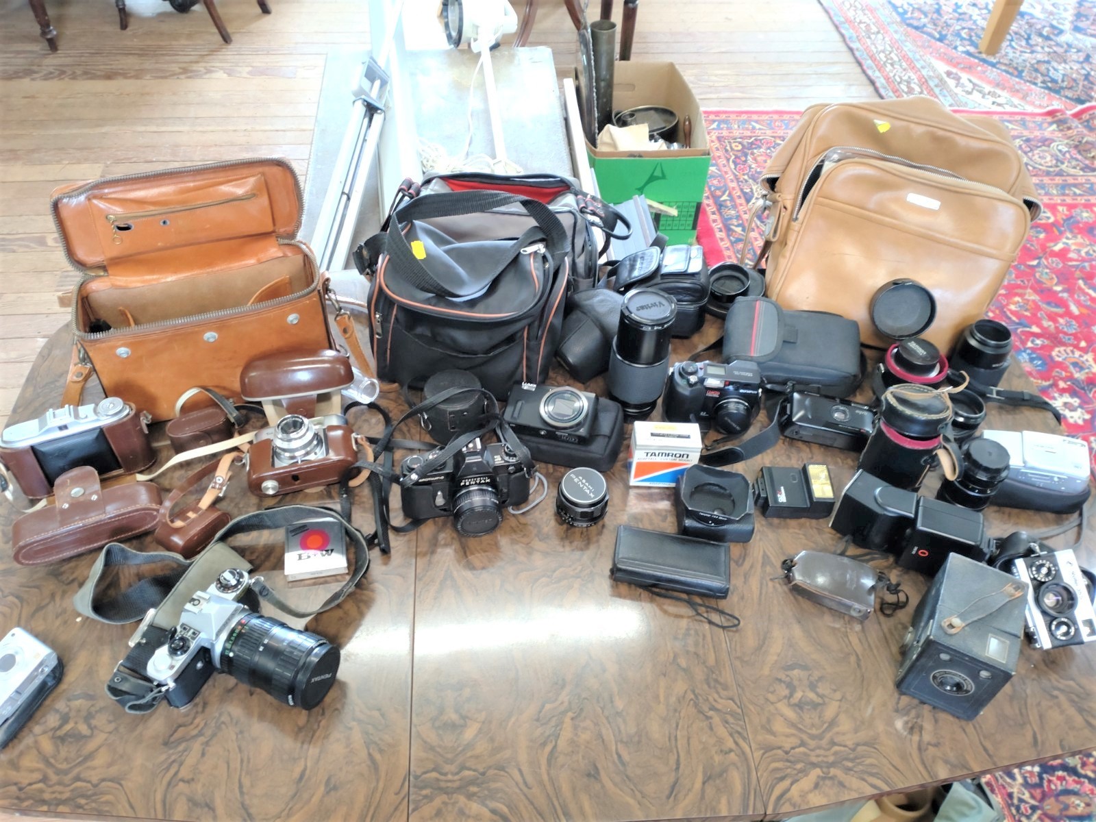 13 vintage Cameras and lenses. Early 20th century.