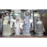 Three Lladro figures of girls 21cm to 29cm and a Nao figure of a young lady 25cm (4)