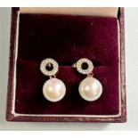 A Pair of 9ct rose gold pearl and diamond drop earrings