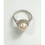 9ct white gold cultured pearl and R/C diamond halo ring.