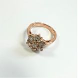 Certificated 18ct rose gold -7-stone daisy-style Round Brilliant Cut Diamond ring.