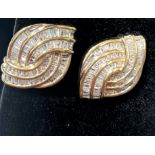 Pair of 9ct yellow gold diamond swirl earrings, boxed. Baguette diamonds 2.50ct approx.