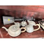 A four Piece pewter Teaset and some fire irons.
