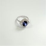 Certificated 18ct white gold oval-cut loupe clean tanzanite and diamond cluster ring.