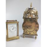 Two clocks. Comprising a carriage clock and lantern clock. 20th century.