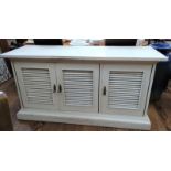 A mahogany storage cabinet painted white. 20th century. With drawers