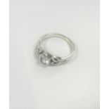Silver Celtic-style ring set with oval white cubic zirconia. Size P and a half.