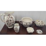 A ceramic toilet set comprising a large jug, chamber pot, soap dishes, and vase. (5)