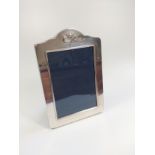 A silver Richard Carr Sheffield 1994 photo frame with golf clubs and ball design to top, size 9cm