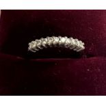 A Half Diamond Set Eternity Ring. Set in 18 carat white gold. Size J. 2.73 grams.