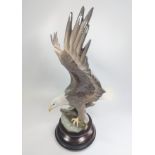 Lladro 1738 Eagle decorated by N Navarra 39cm with circular wood stand.