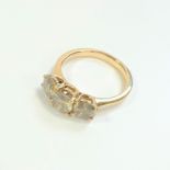 Certificated 18ct yellow gold Round Brilliant Cut diamond trilogy ring.