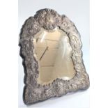 A Victorian Sterling Silver mounted Easel Mirror. London 1888. Ornately embossed. 46cm high.