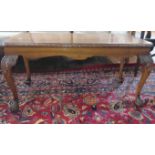 A walnut rectangular coffee table with claw and ball feet. 90cm x 45cm x 45cm