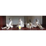 Four Nao figures of girls, three seated and one lying down (4)