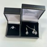 Silver jewellery suite: Earrings, ring and pendant with chain.