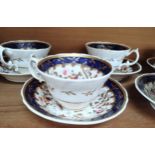 An English porcelain tea service and coffee cups.