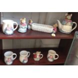 A Japanese Otagiri Cat tea-set comprising teapot jug, oblong dish, bowl and cover and four mugs. (8)