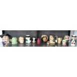 Fourteen ceramic character jugs including Royal Doulton Mine Host and Crown Derby Sheikh (14)