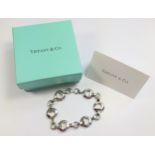 A Tiffany silver heart link bracelet by Elsa Peretti.