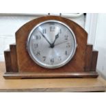 A 1930's walnut cased mantel clock.