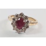 Oval ruby and diamond cluster ring set in 9ct yellow and white gold. Ruby 0.80ct approx. Diamonds