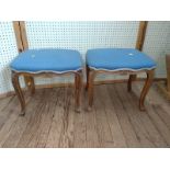 A pair of matching footstools.