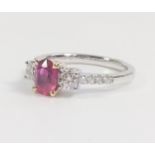 Fine quality 18ct white gold oval ruby and Round Brilliant C ut diamond trilogy ring with diamond