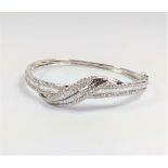 Certificated 18ct white gold baguette and Round Brilliant Cut diamond bangle. Diamonds 2.71ct.