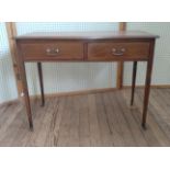 A Mahogany desk. Circa 1900. With a leather inset top on brass casters. 80 x 107 x 49cm.