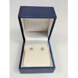 A pair of 18ct white diamond studs, boxed. Round Brilliant Ccut diamonds, approximately 0.40ct