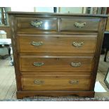 A late Victorian mahogany chest of drawers. Fitted with two short and three long graduated