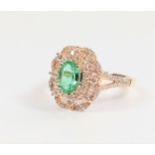 14ct yellow gold oval emerald, baguette cut diamonds and RBC diamonds cluster ring with diamond