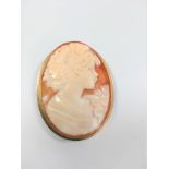 A cameo set in high carat yellow metal. 40mm long.