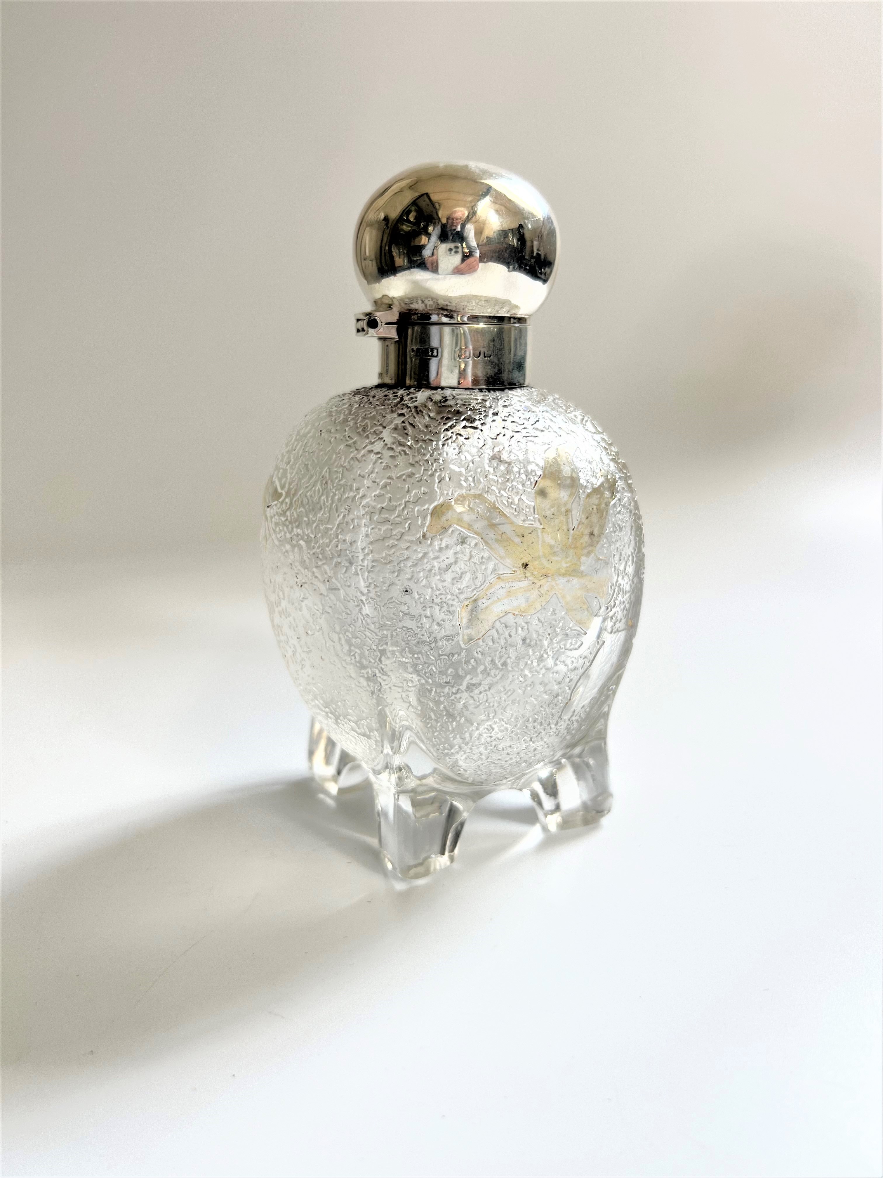 A late Victorian Glass and sterling silver mounted Scent Bottle. London 1896.