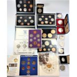 A collection of coins in their presentation cases.