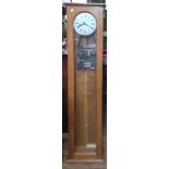 An Electric slave clock. Vintage. in glazed oak case.