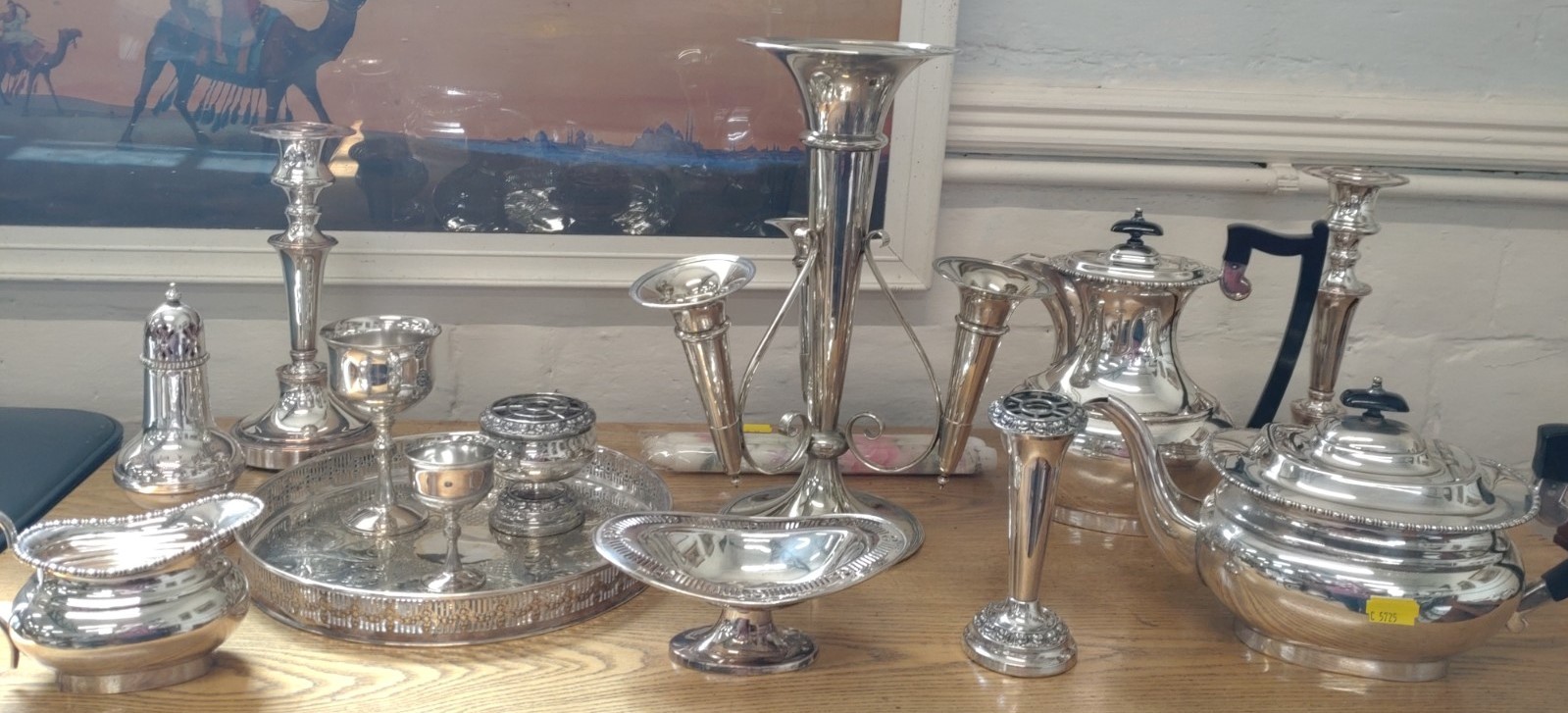 A quantity of electroplated Items. circa 1900. Including an epergne and a pair of candlesticks