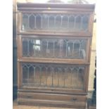 A Globe Wernicke Leaded bookcase (three sections, damage to glass in one section). 120 x 87 x 30cm.