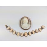 An Antique cameo brooch and bracelet. Brooch cracked. (2)