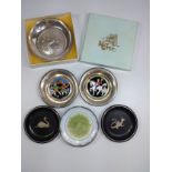 A collection of six various small silver and enamel decorated pin dishes.