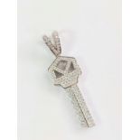 Silver key pendant pave-set with over 100 white round cubic zirconia. Size N. 10.29 grams.