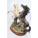 An Italian resin figure of a pair of horses 38cm.