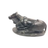 A cast iron figure Nandi. 7cm x 11cm.