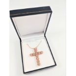 Certificated 9ct rose gold cross set with Round Brilliant Cut diamonds on a 9ct rose gold chain,