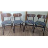 Four mid-century dining chairs, reupholstered with 80's design fabric.