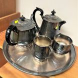 An electroplated four piece tea set with tray.