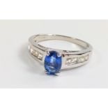 Certificated 9ct white gold ring set with a 0.95ct oval kyanite and white sapphire shoulders. Size